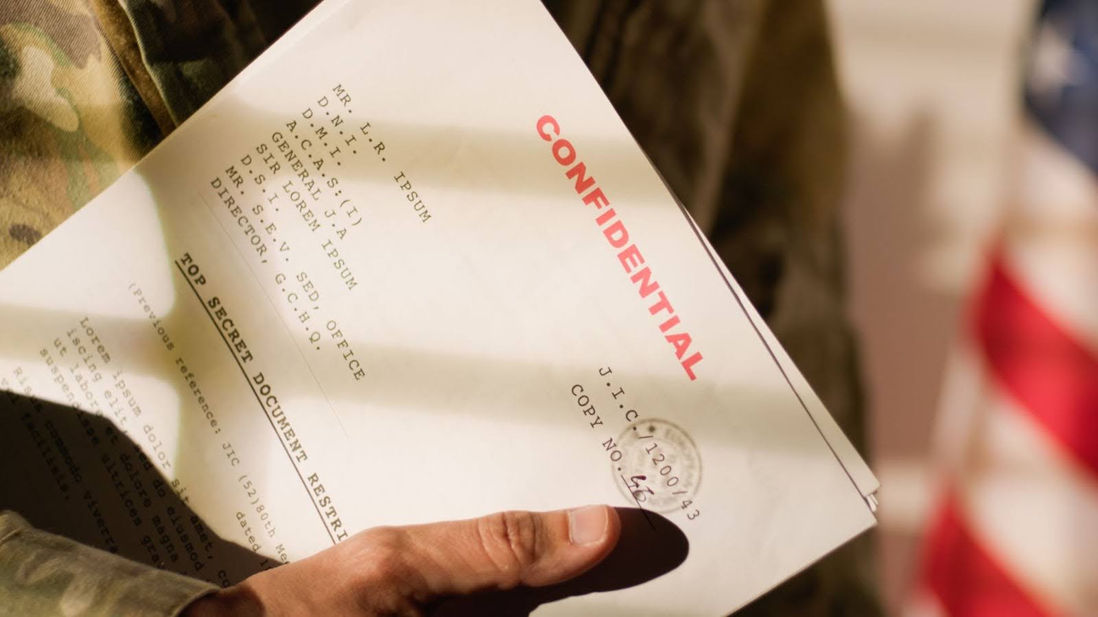 a confidential document in hands of a man