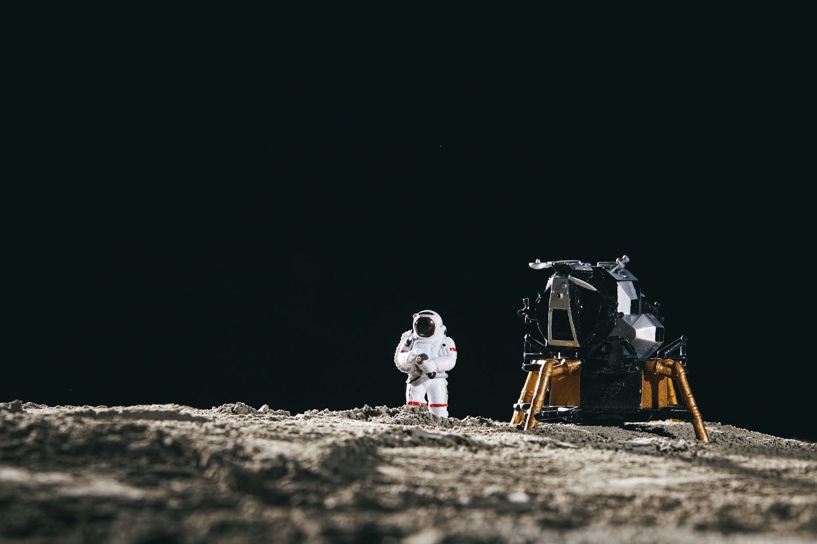 A model of an astronaut on a planet with a machine