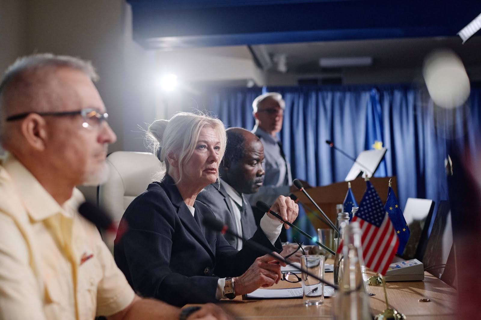 Europe and US representatives sitting at a table during a conference