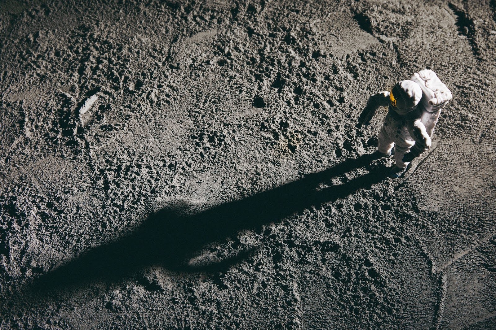 Astronaut walking on a planet's surface