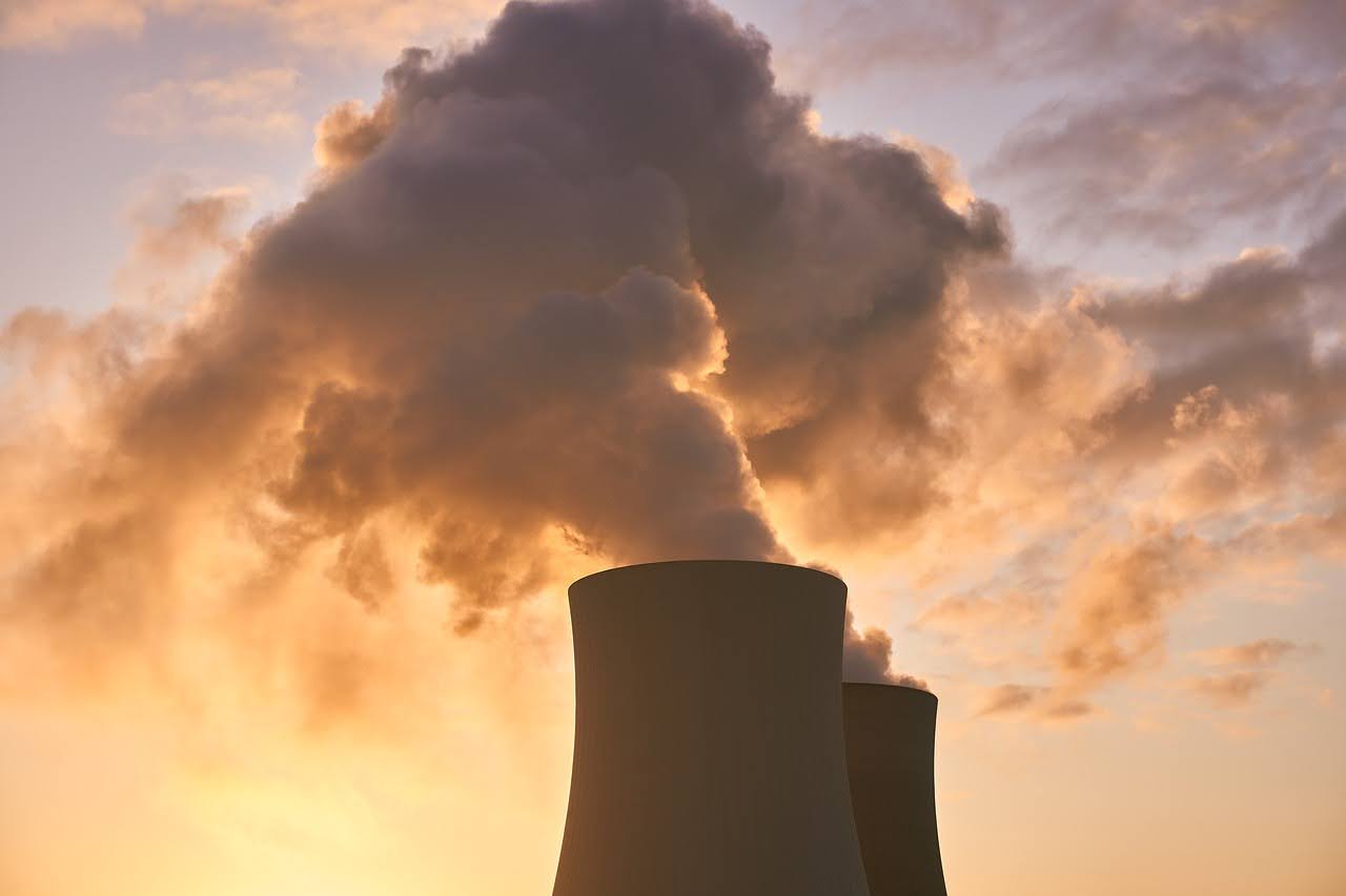 a power plant with smoke