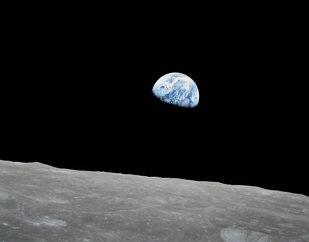 An iconic view of Earth rising above the Moon, called "Earthrise" (Apollo 8, 1968).